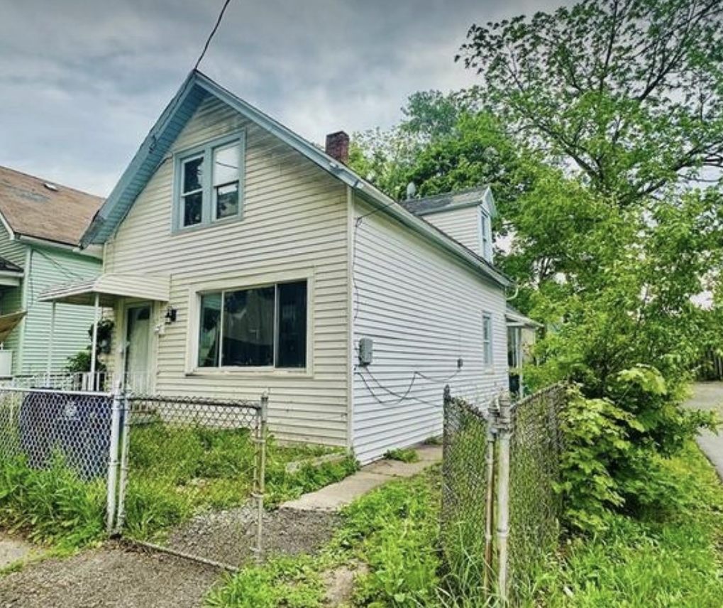 Fenced single family rental property with a driveway in Buffalo, New York